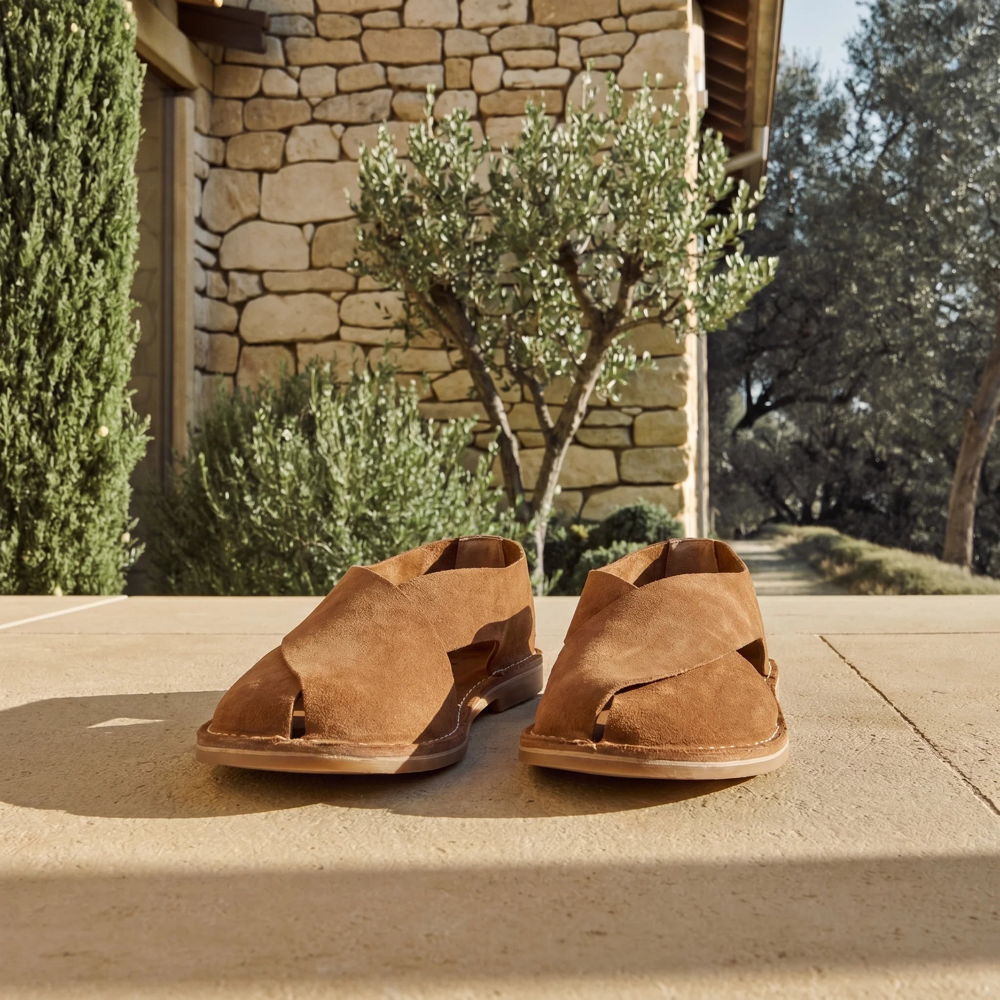 Cross-strap sandal in suede sheepskin set in an elegant Tuscan setting