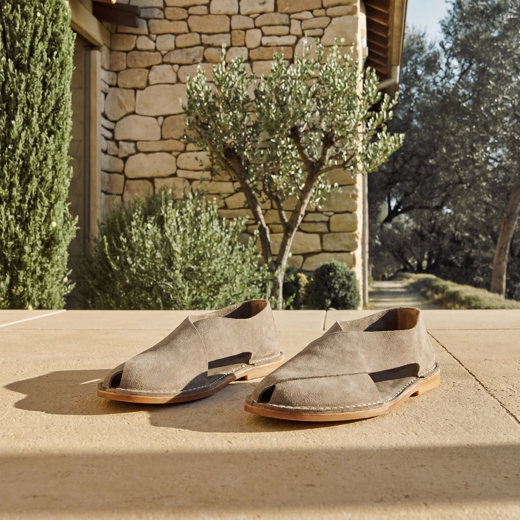 Cross-strap sandal in suede sheepskin set in an elegant Tuscan setting