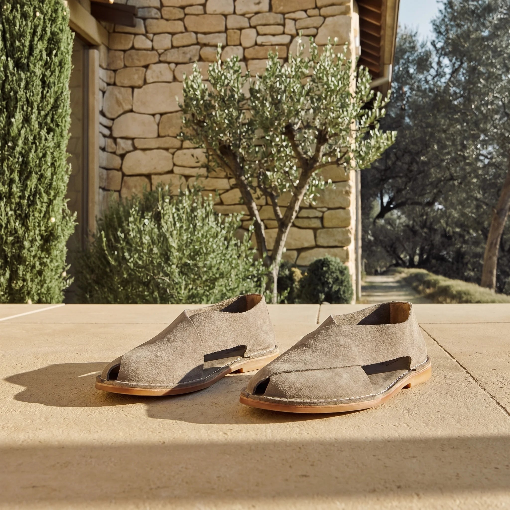 Cross-strap sandal in suede sheepskin set in an elegant Tuscan setting